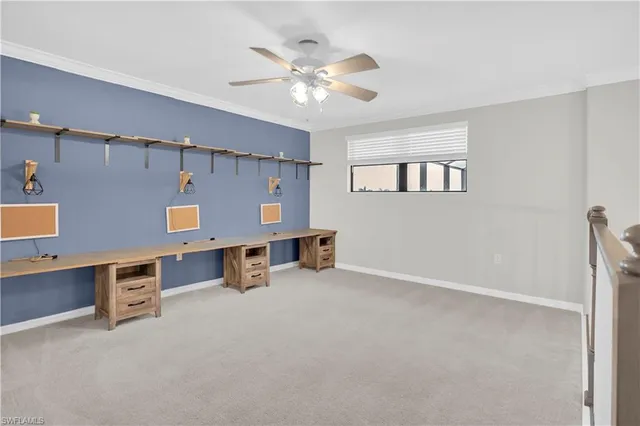 a room with wooden cabinets and ceiling fan