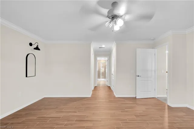 a view of a chandelier fan and entryway with chandelier fan