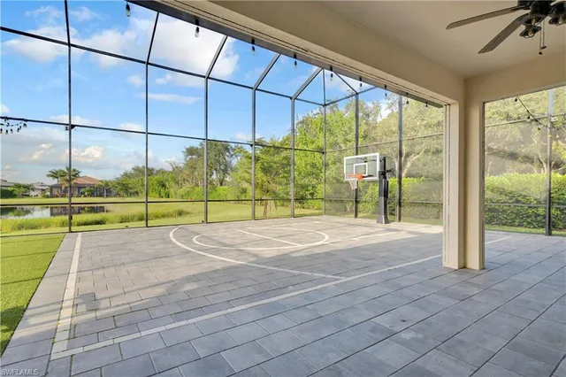 a view of a swimming pool with a back yard