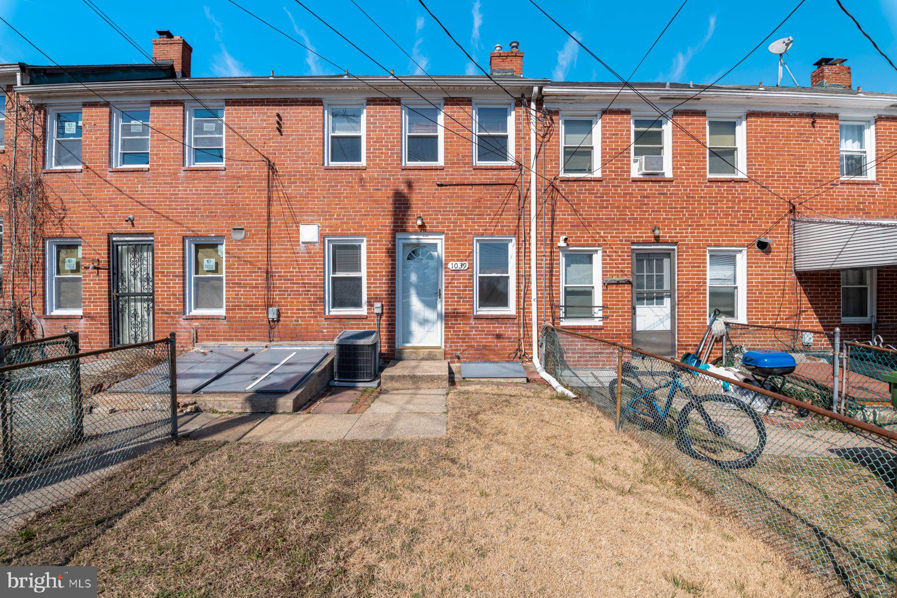 1039 Cameron Road Baltimore, MD 21212 - Photo 25 of 26 a view of a brick house with many windows
