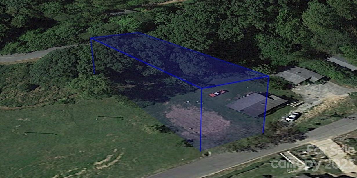 0 East Howard Street Tryon, NC 28782 - Photo 1 of 5 an aerial view of a house with a yard
