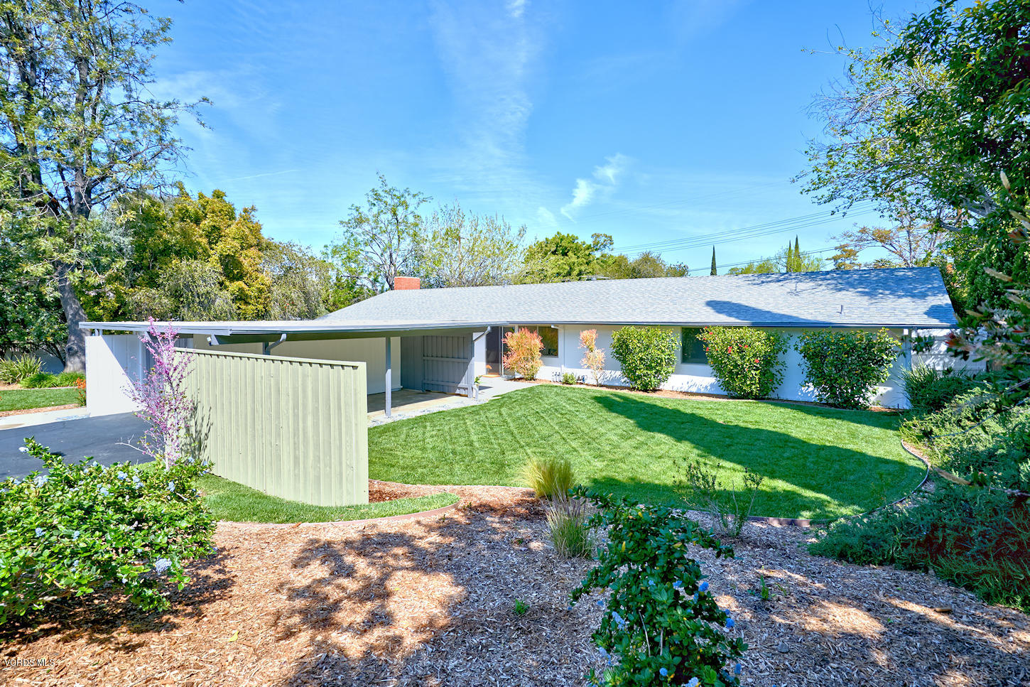 17031 Labrador Street Northridge, CA 91325 - Photo 2 of 20 a front view of a house with garden