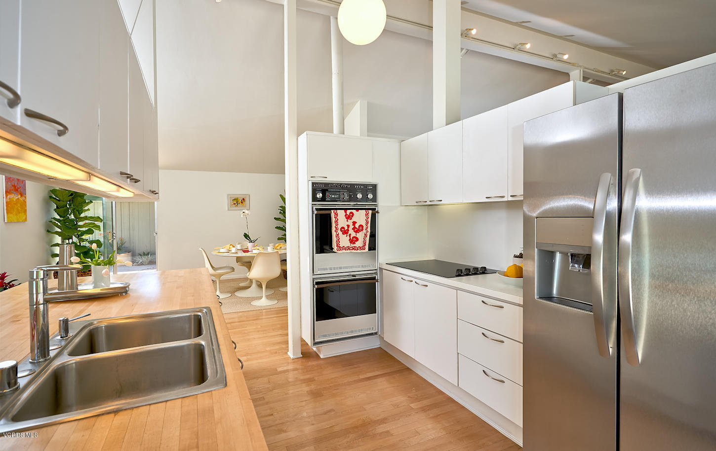 17031 Labrador Street Northridge, CA 91325 - Photo 11 of 20 a kitchen with white cabinets and white appliances