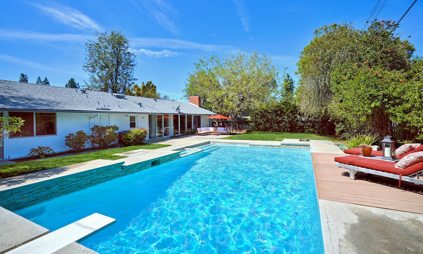 17031 Labrador Street Northridge, CA 91325 - Photo 17 of 20 a front view of a house with swimming pool having outdoor seating