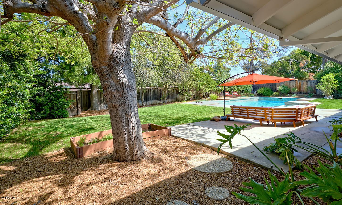 17031 Labrador Street Northridge, CA 91325 - Photo 18 of 20 a backyard of a house with barbeque oven fire pit table and chairs