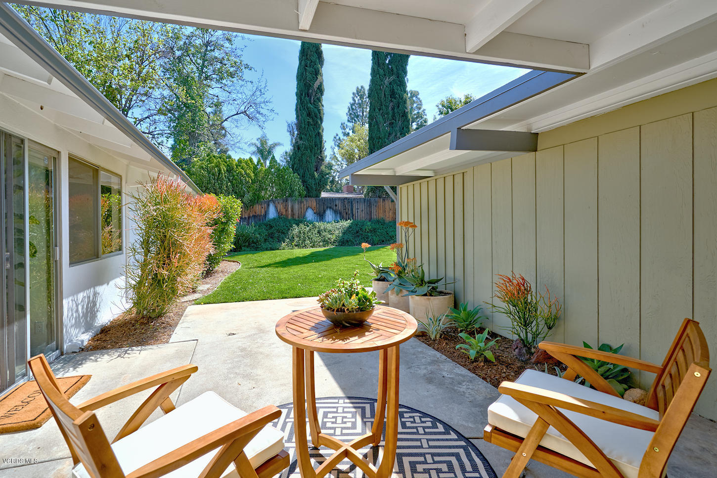17031 Labrador Street Northridge, CA 91325 - Photo 19 of 20 a backyard of a house with table and chairs