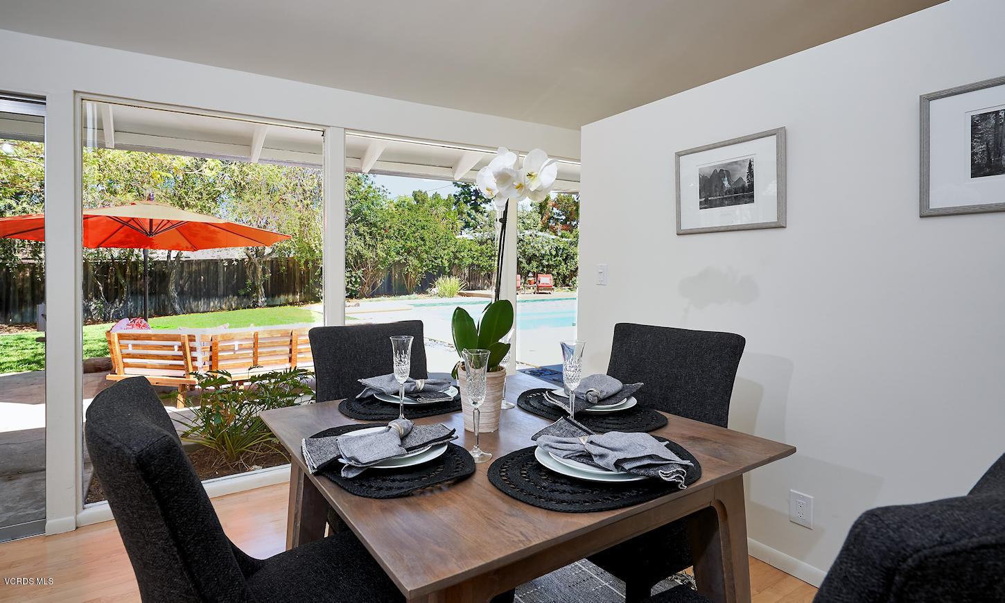 17031 Labrador Street Northridge, CA 91325 - Photo 6 of 20 a view of a dining room with furniture and floor to ceiling windows