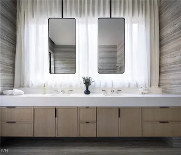 a bathroom with a sink and a window