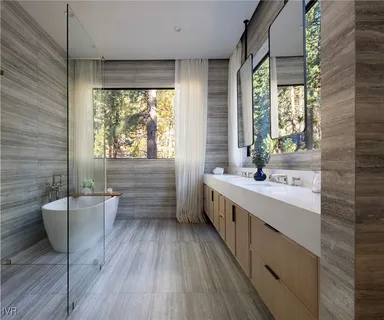 a white tub sitting in a bathroom