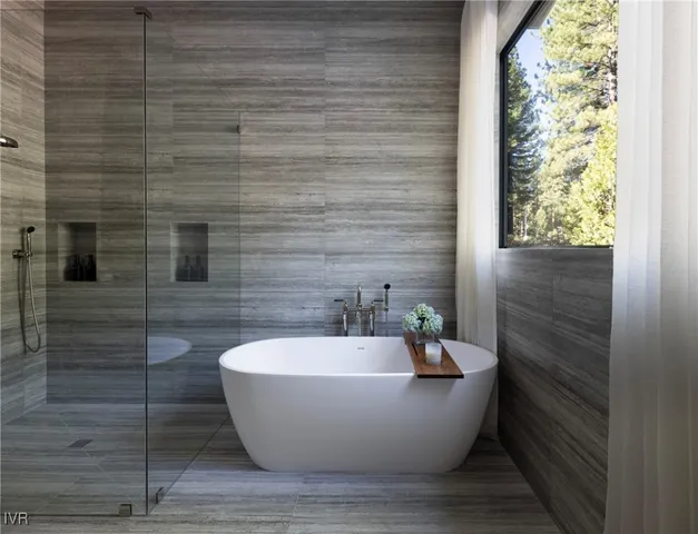 a white tub sitting in a bathroom