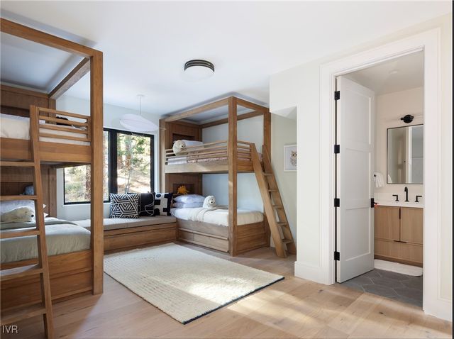 a view of a livingroom with furniture and staircase