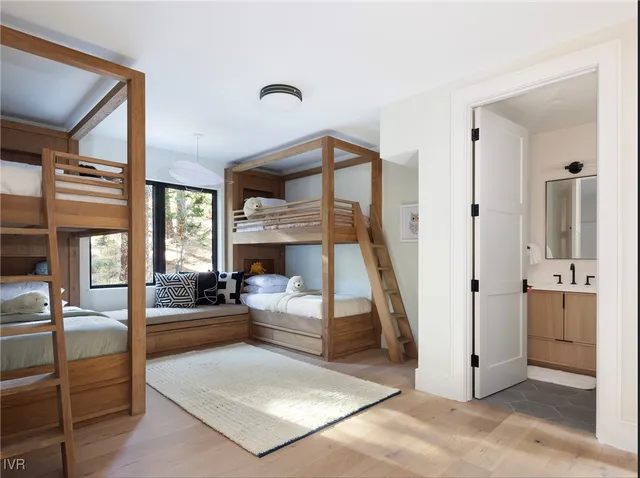 a view of a livingroom with furniture and staircase