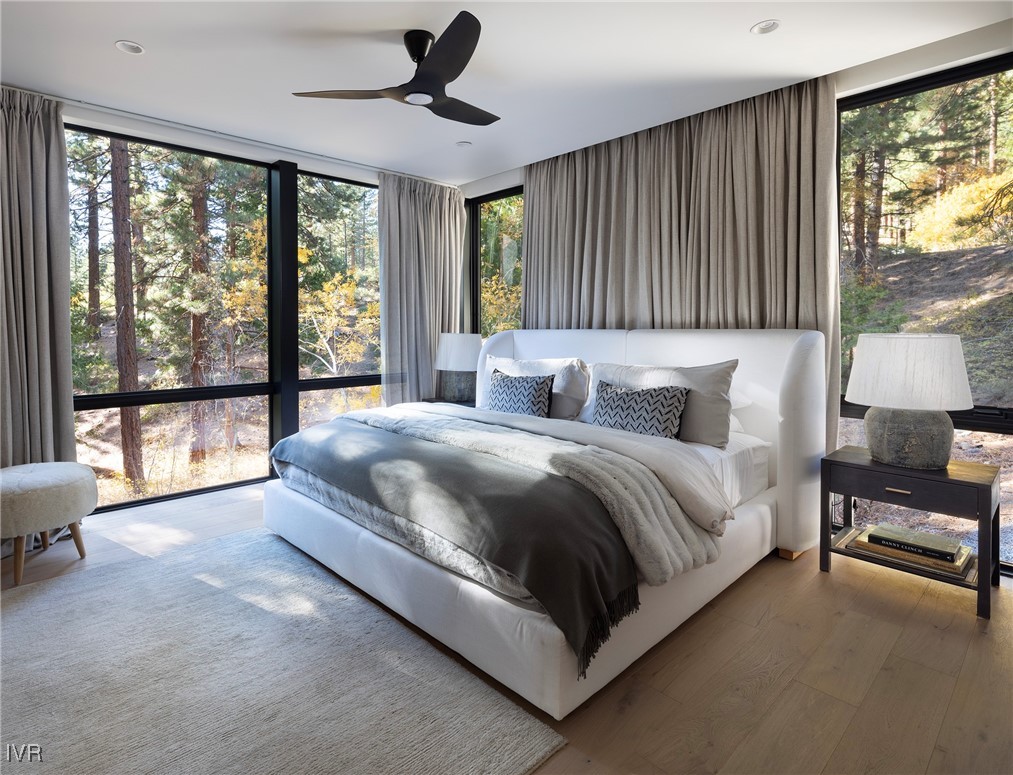 727 Kelly Drive Incline Village, NV 89451 - Photo 26 of 40 a spacious bedroom with a large bed and a large window