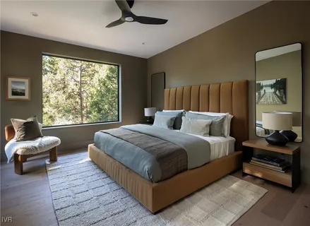 a bedroom with bed and window