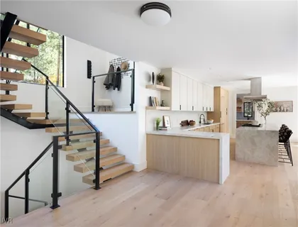 a view of kitchen with furniture and staircase