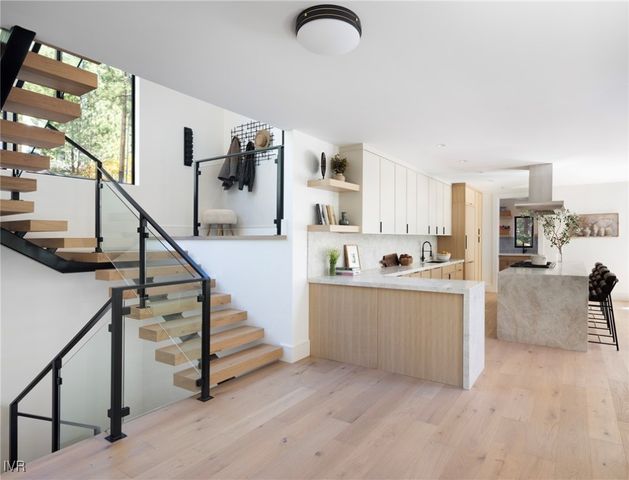 a view of kitchen with furniture and staircase