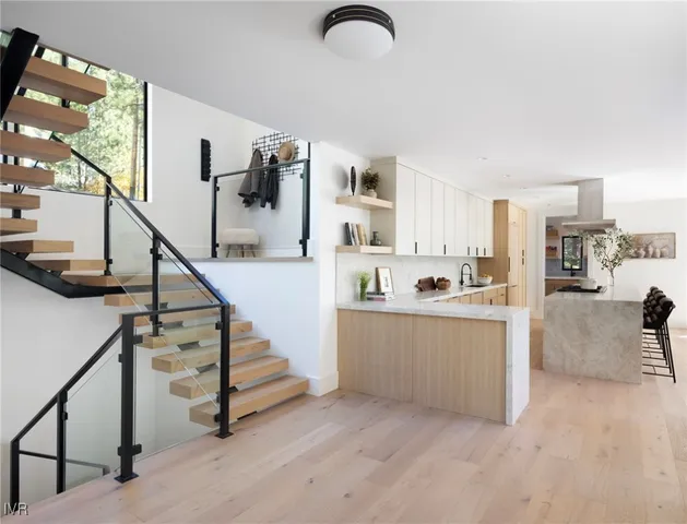 a view of kitchen with furniture and staircase