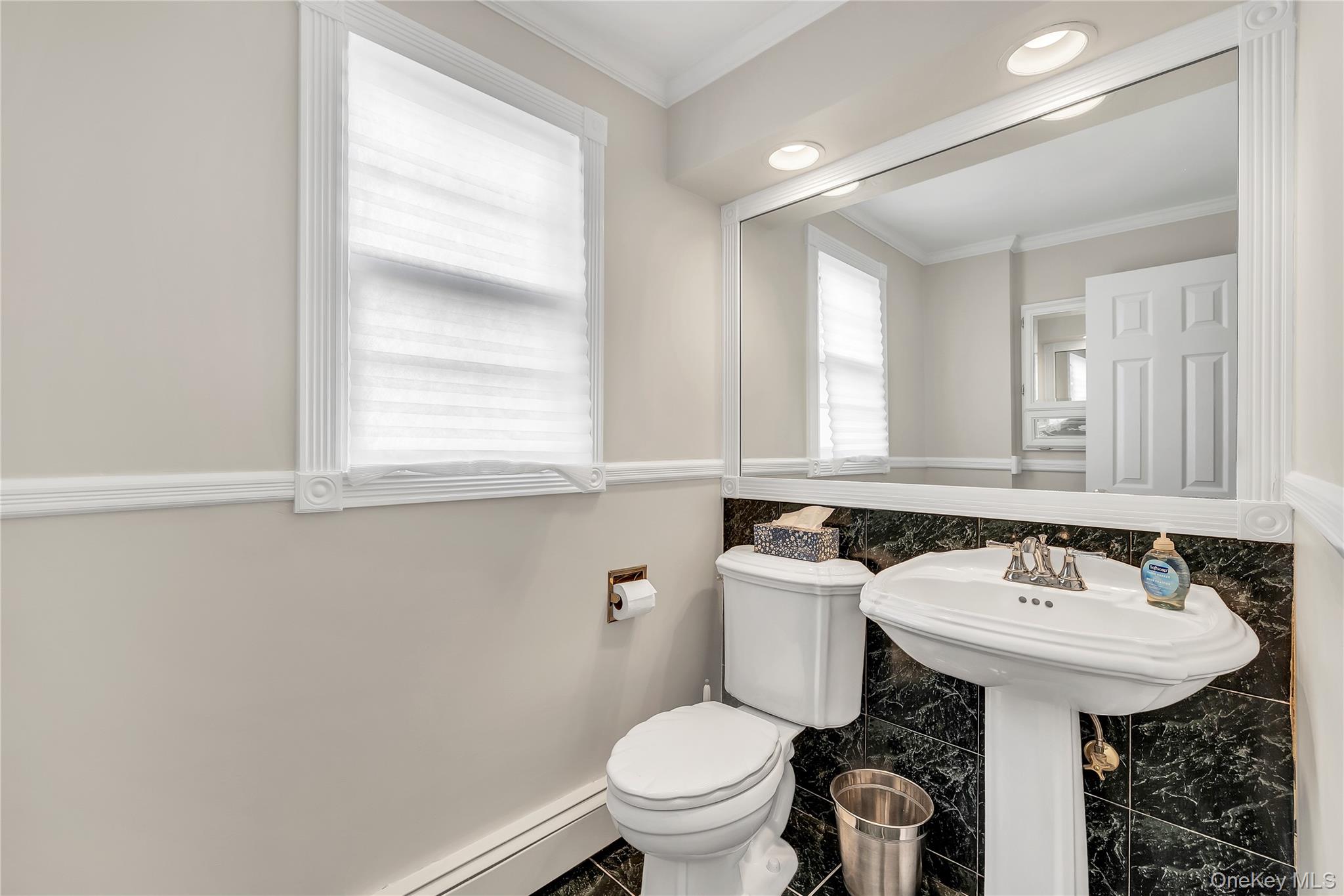 155 Fairview Road Farmingdale, NY 11735 - Photo 11 of 23 a bathroom with a sink toilet and a mirror
