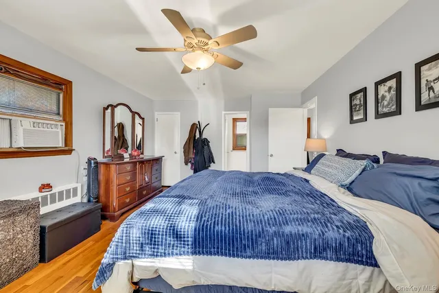 a bed room with a bed and dresser