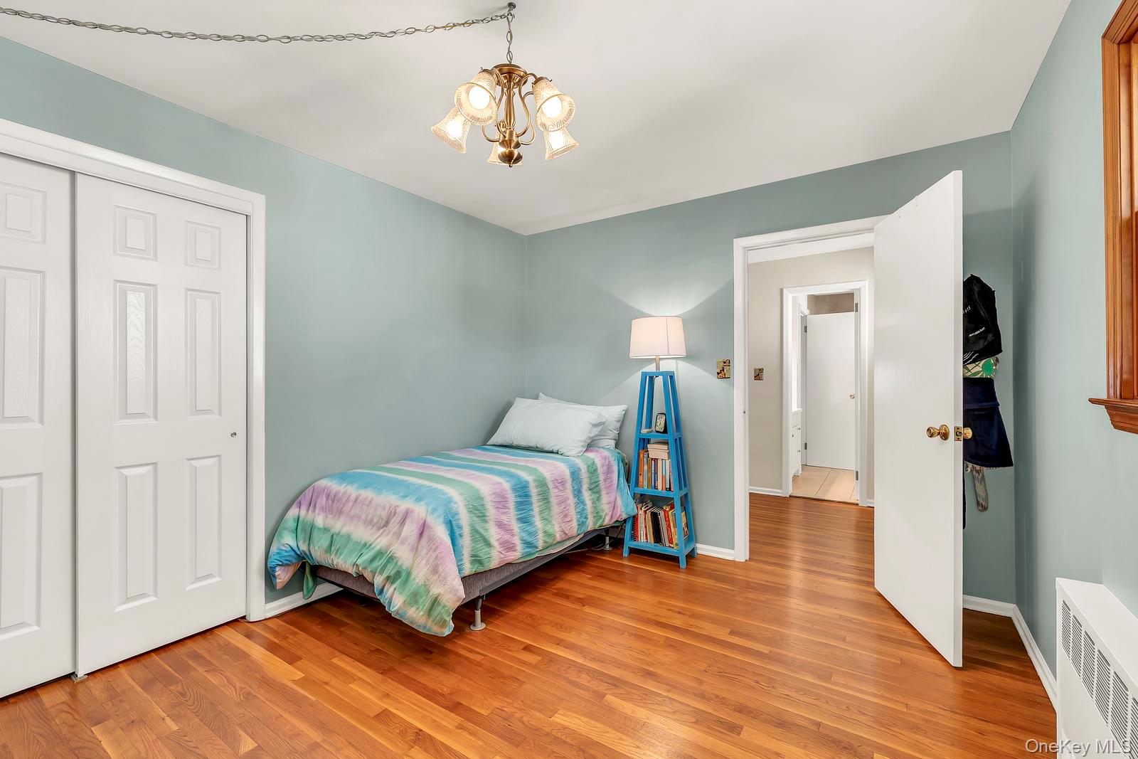 155 Fairview Road Farmingdale, NY 11735 - Photo 18 of 23 a bedroom with a bed and wooden floor