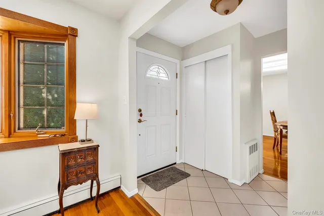 a view of an entryway with wooden floor