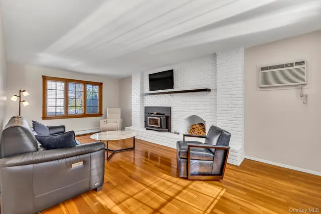 a living room with furniture fireplace and flat screen tv