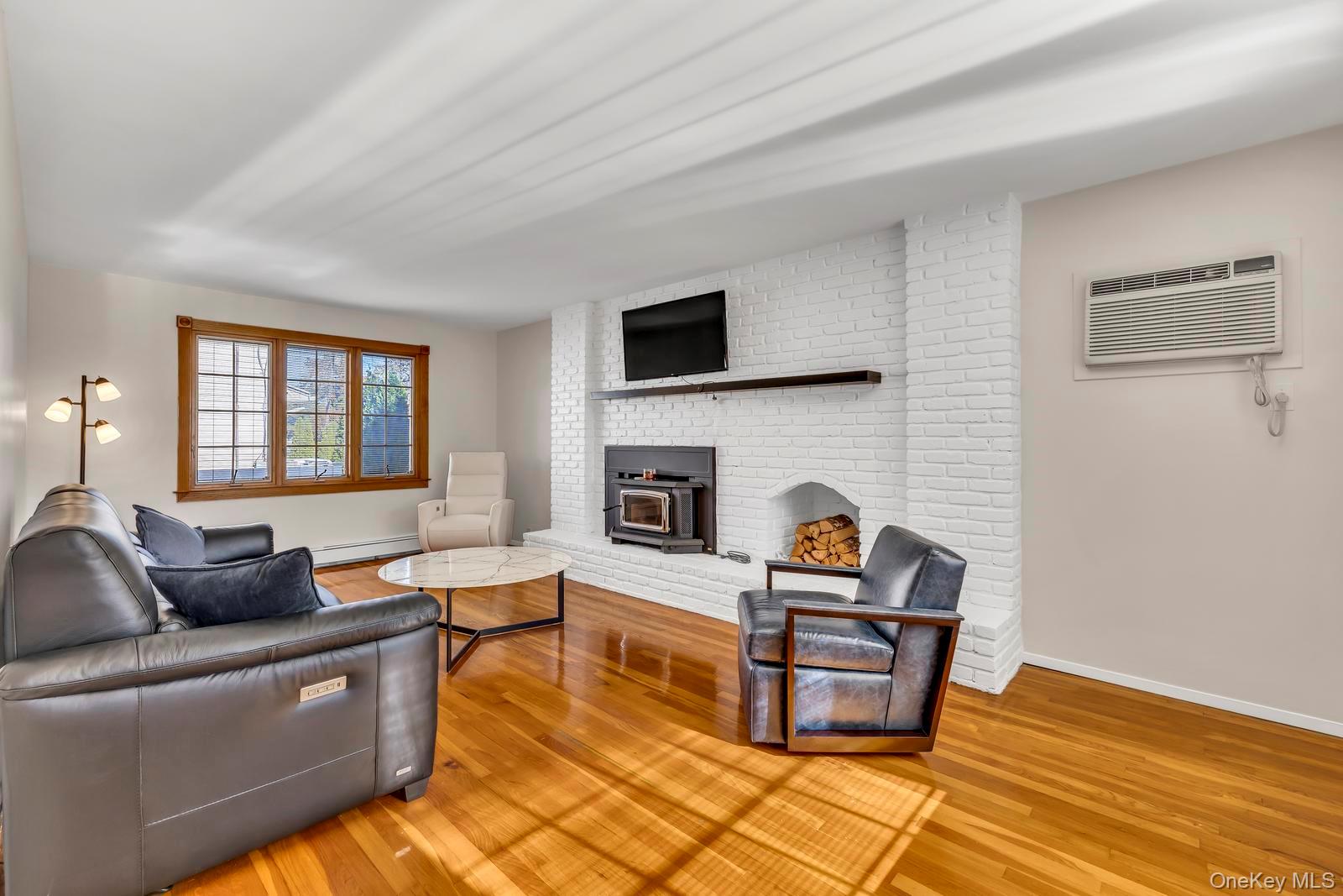 155 Fairview Road Farmingdale, NY 11735 - Photo 6 of 23 a living room with furniture fireplace and flat screen tv