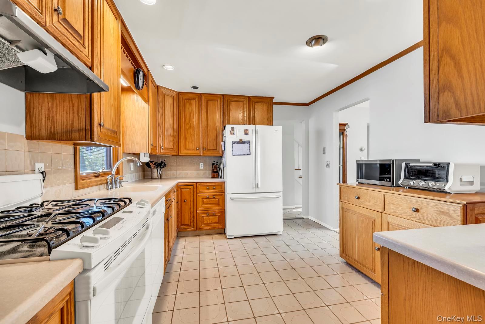 155 Fairview Road Farmingdale, NY 11735 - Photo 10 of 23 a kitchen with a stove a sink dishwasher and a refrigerator