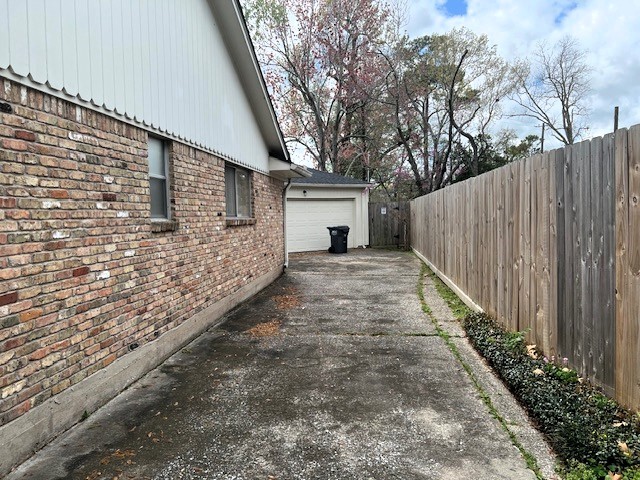 8639 Cedarbrake Drive Spring Valley Village, TX 77055 - Photo 18 of 26 This inviting driveway leads to a convenient two-car garage, perfect for secure parking and storage.