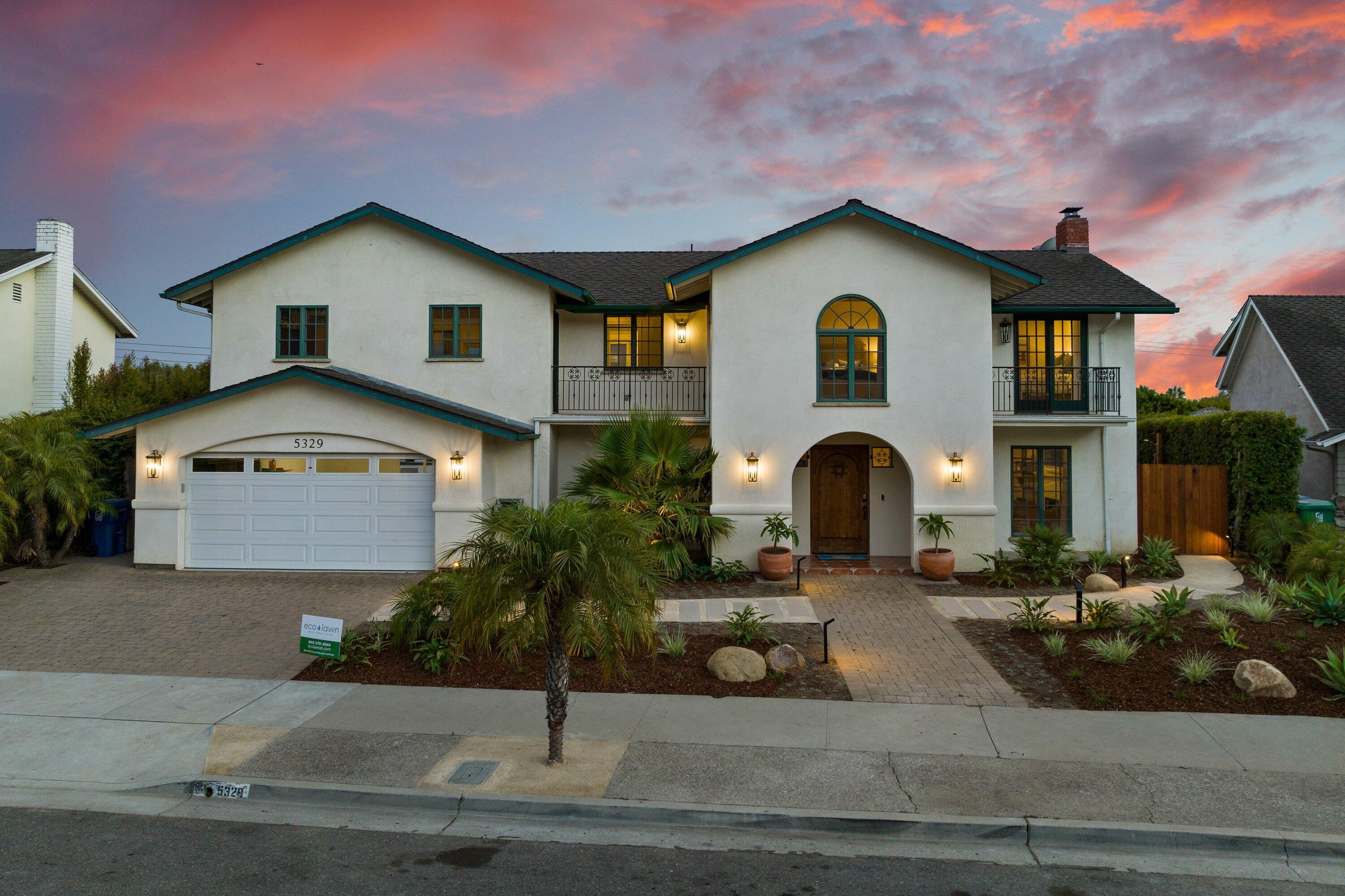 5329 University Drive Santa Barbara, CA 93111 - Photo 11 of 51 a front view of a house with a yard and garage