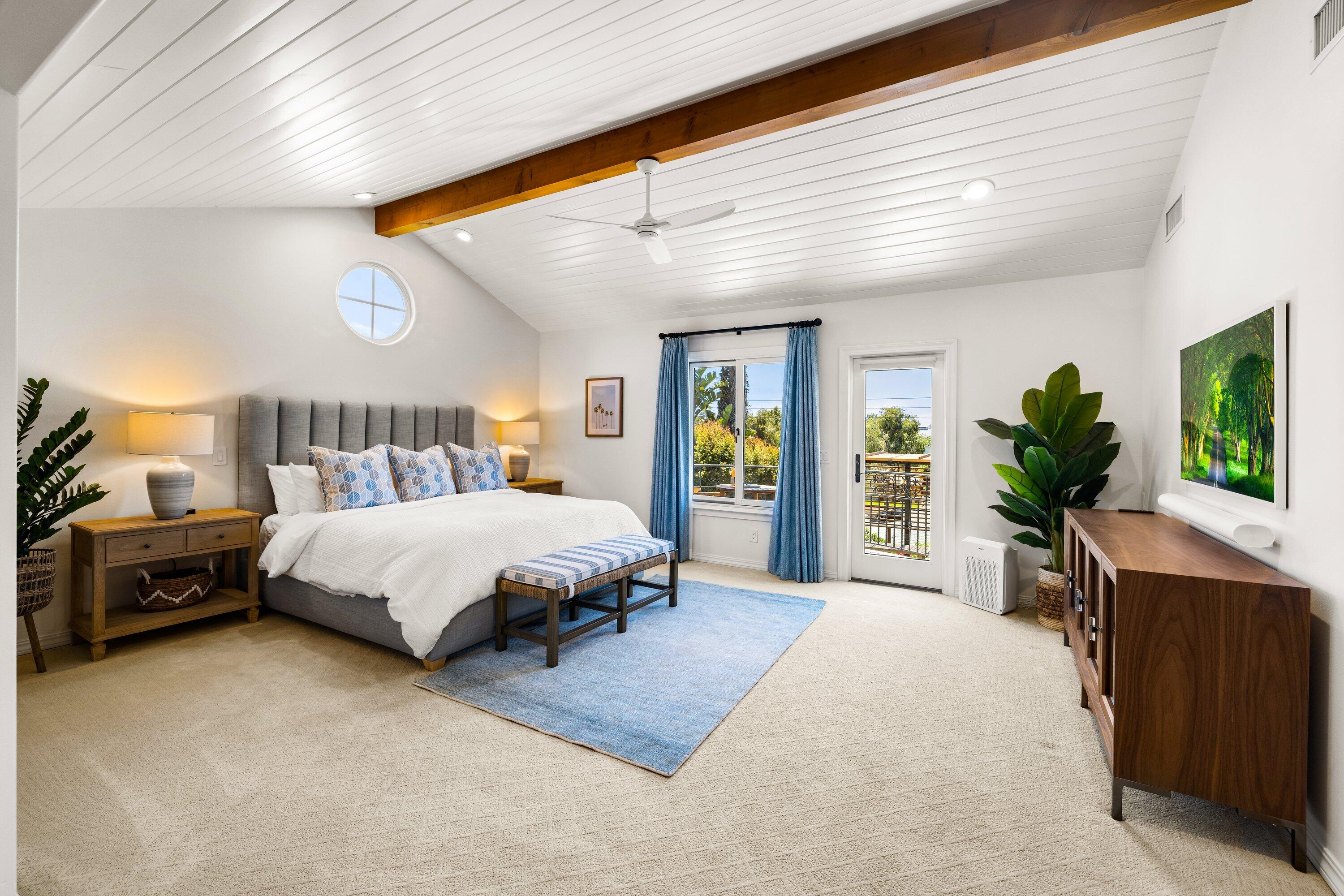5329 University Drive Santa Barbara, CA 93111 - Photo 16 of 51 a spacious bedroom with a large bed and a flat tv screen on dresser
