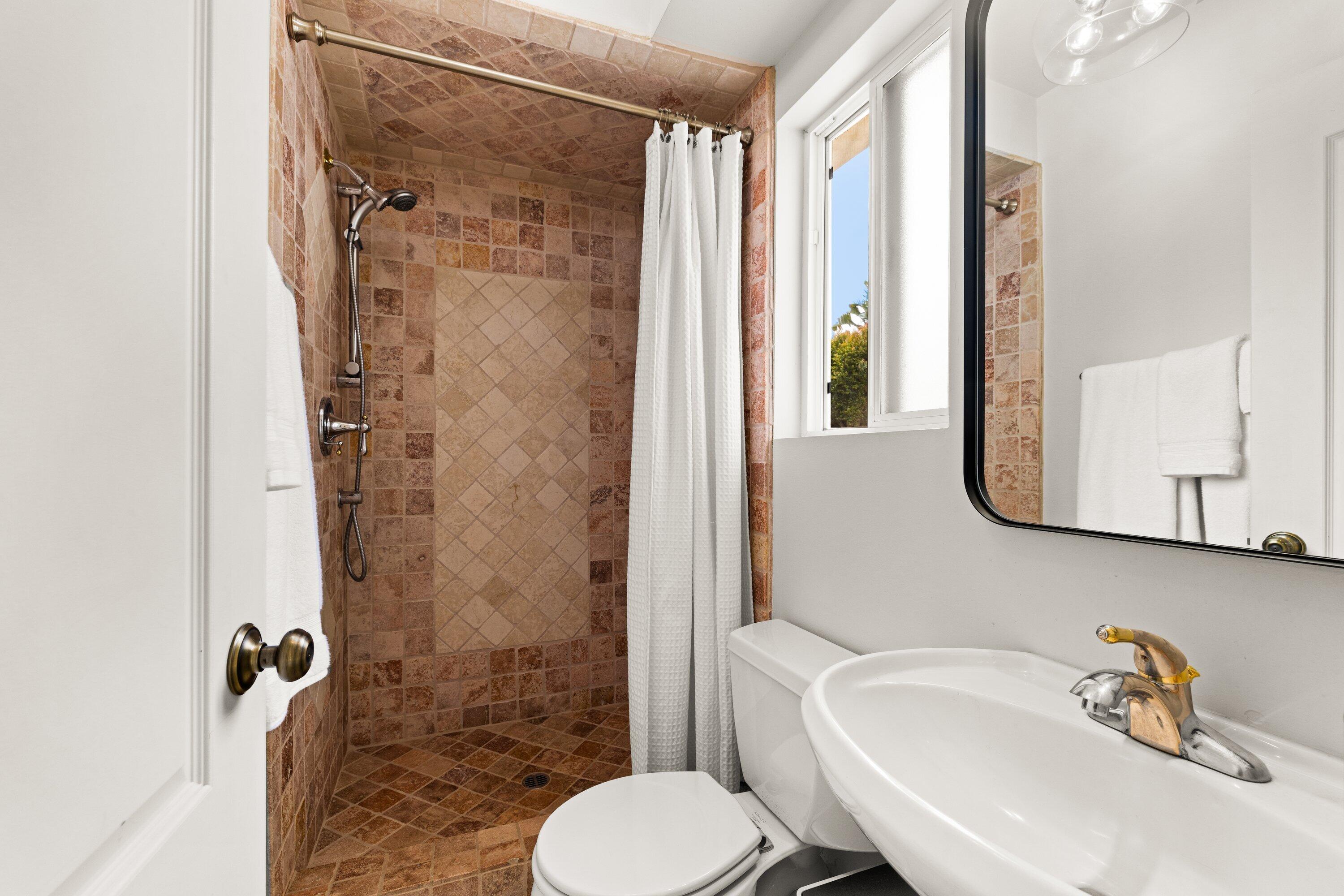 5329 University Drive Santa Barbara, CA 93111 - Photo 19 of 51 a bathroom with a sink toilet and shower