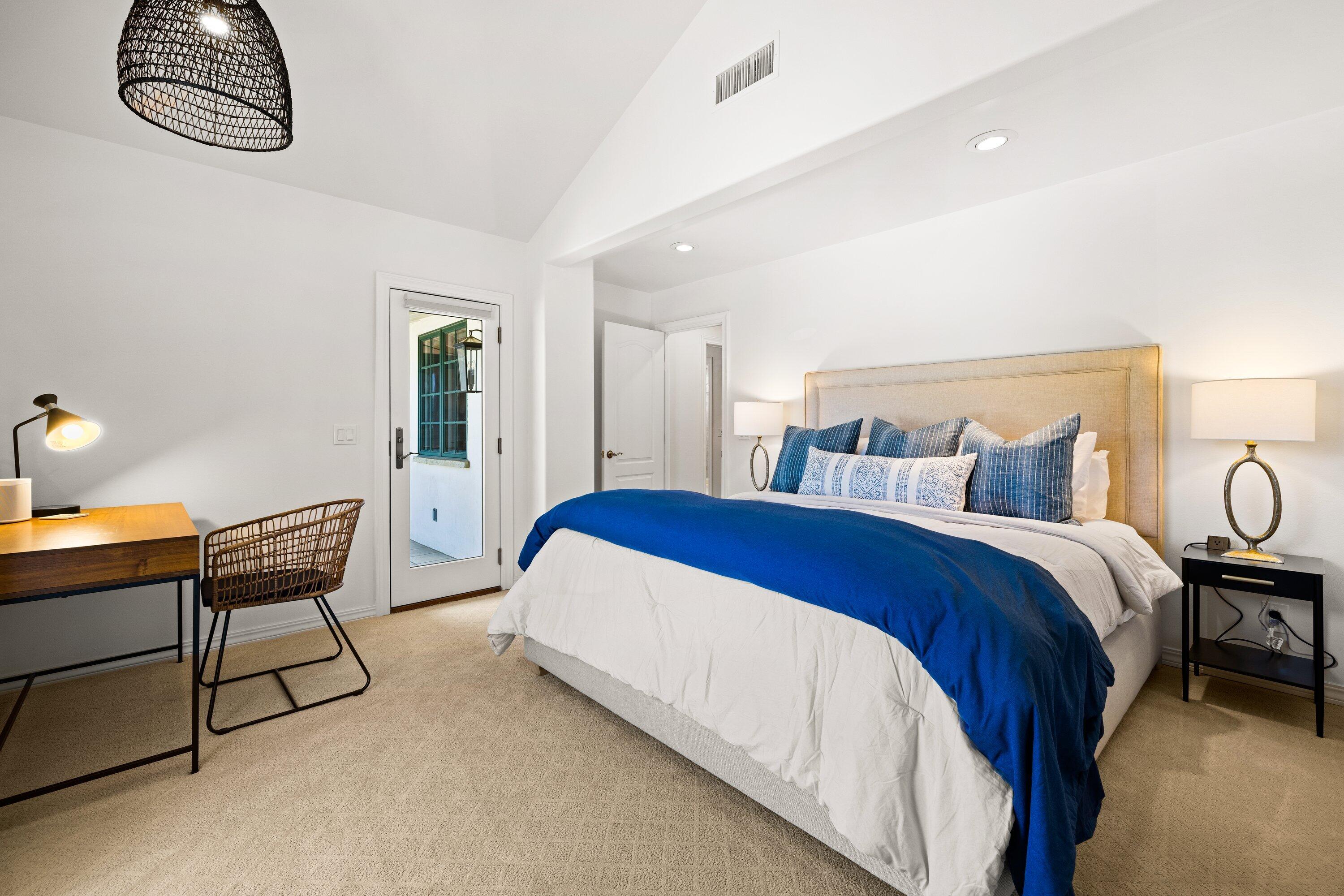 5329 University Drive Santa Barbara, CA 93111 - Photo 21 of 51 a spacious bedroom with a bed and a chandelier