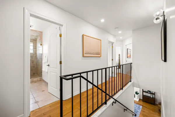 a bathroom with a double vanity sink mirror double shower and a bathtub