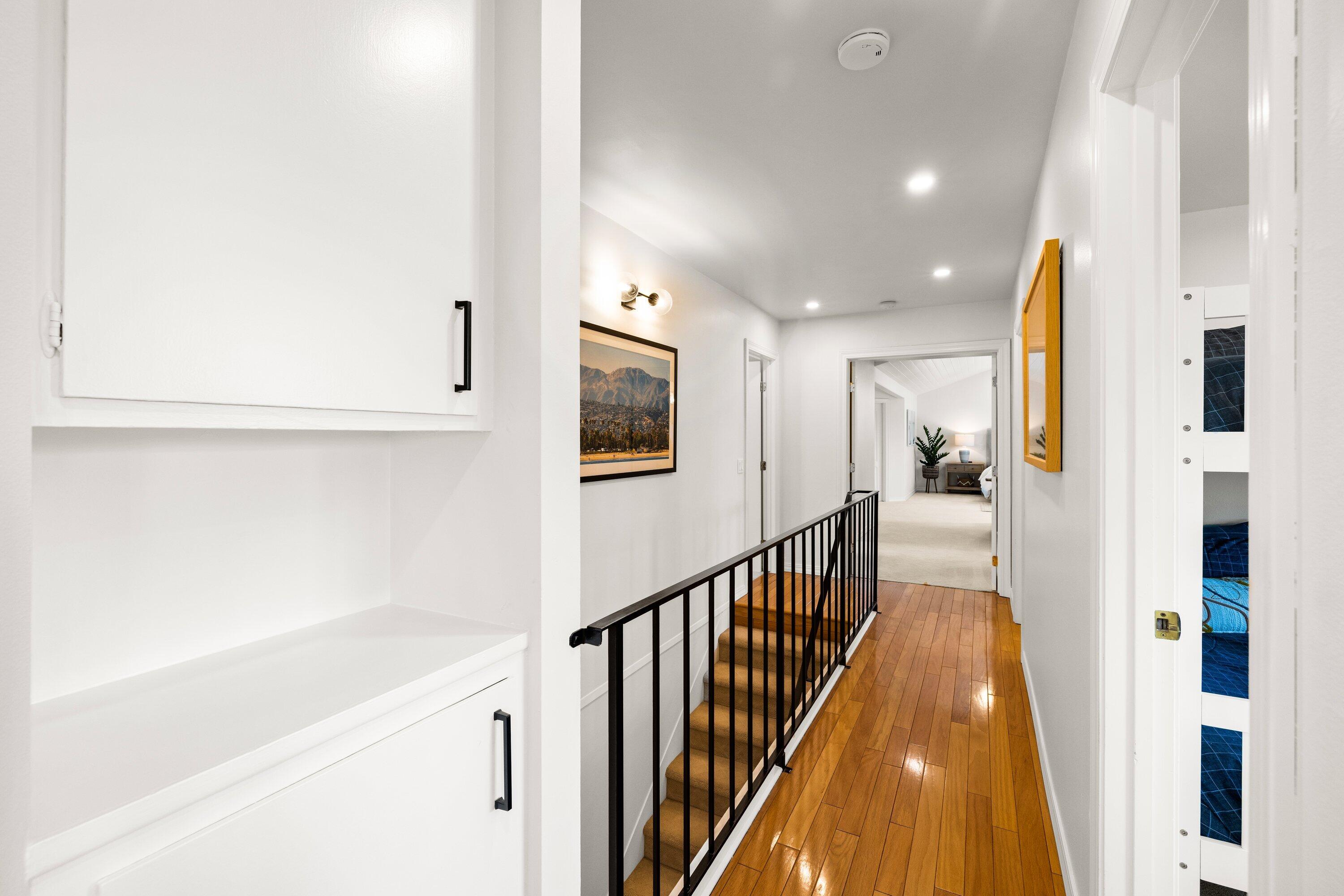 5329 University Drive Santa Barbara, CA 93111 - Photo 27 of 51 a view of a hallway with wooden floor and staircase