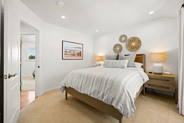 a bedroom with furniture and a window