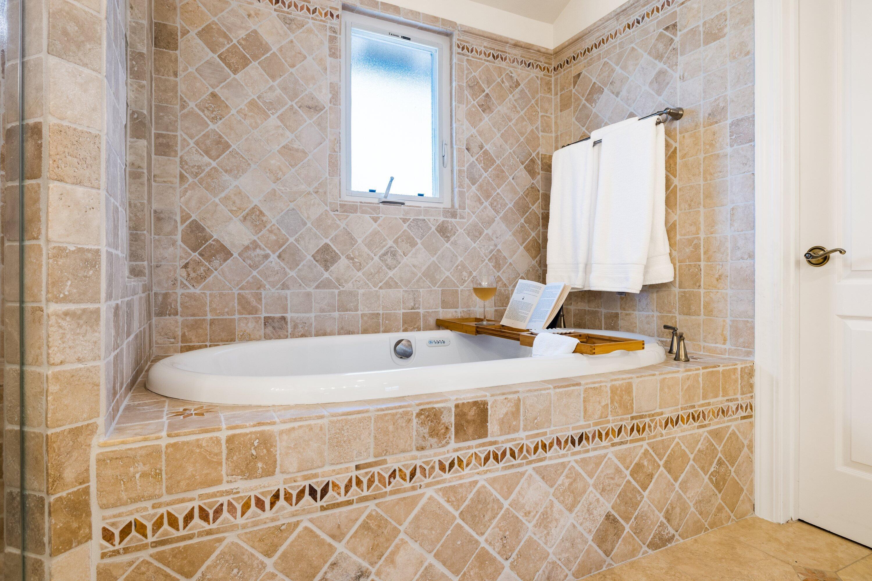 5329 University Drive Santa Barbara, CA 93111 - Photo 36 of 51 a bathroom with a tub and a sink