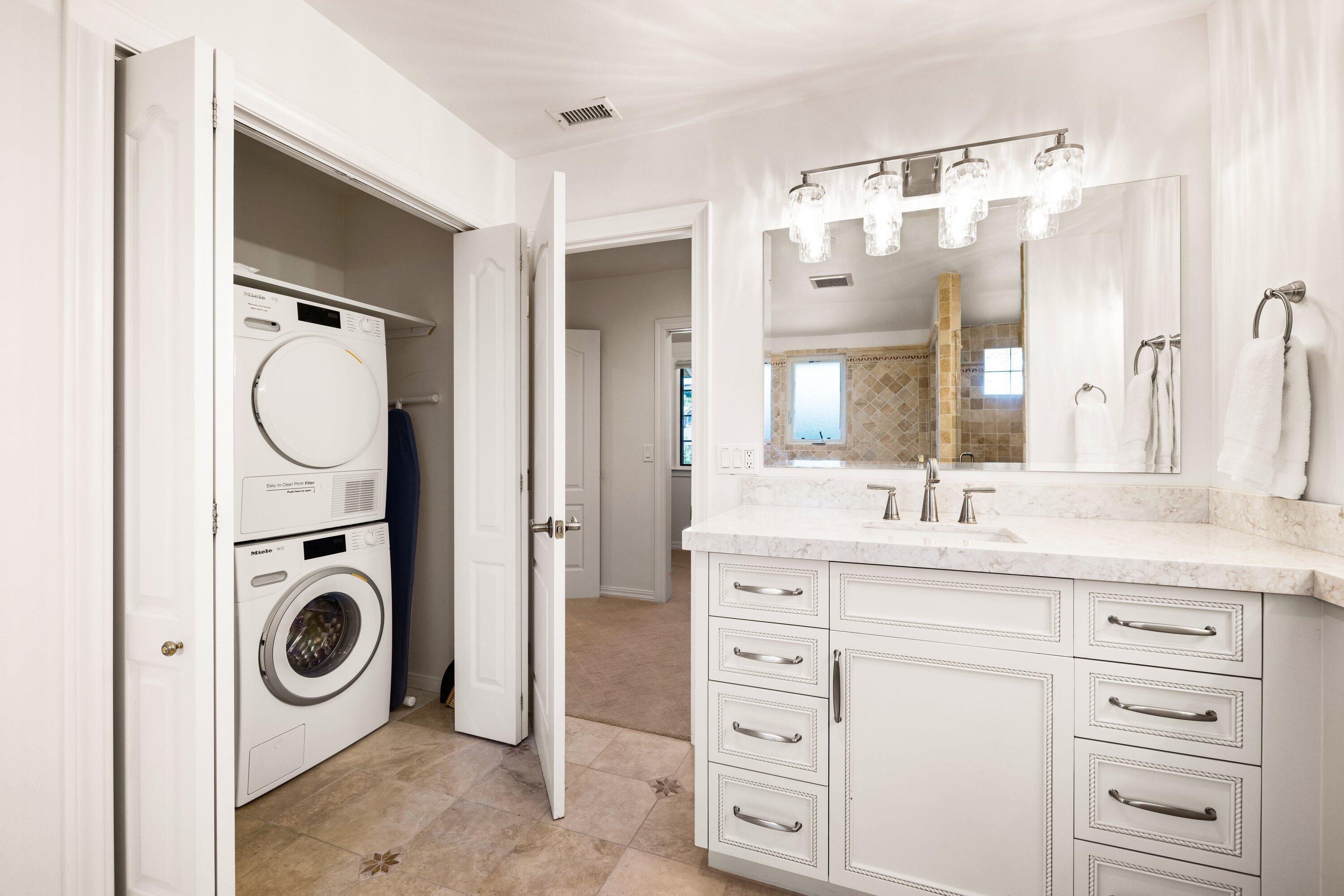 5329 University Drive Santa Barbara, CA 93111 - Photo 37 of 51 a bathroom with a granite countertop sink and a mirror