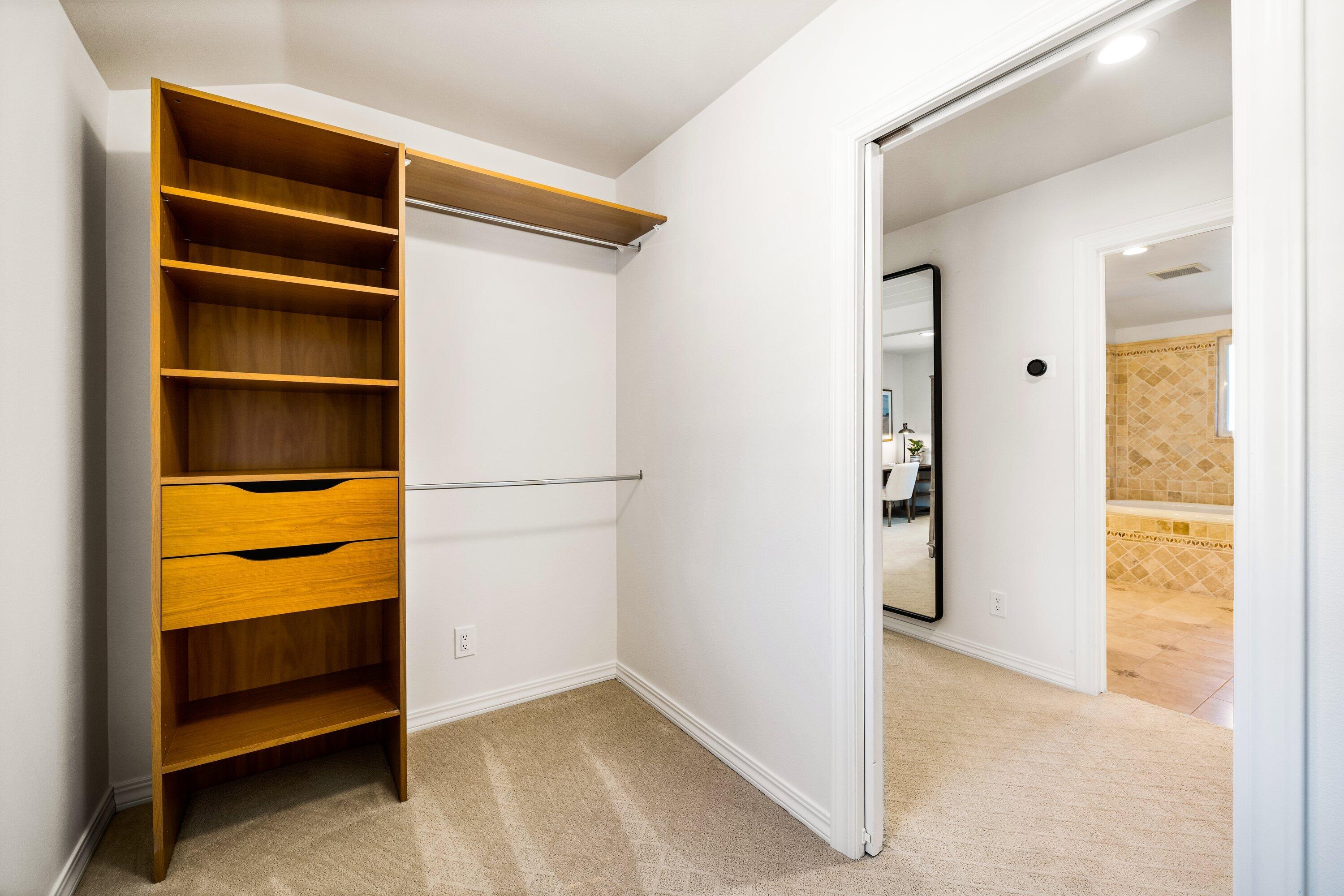5329 University Drive Santa Barbara, CA 93111 - Photo 38 of 51 a view of walk in closet with empty racks