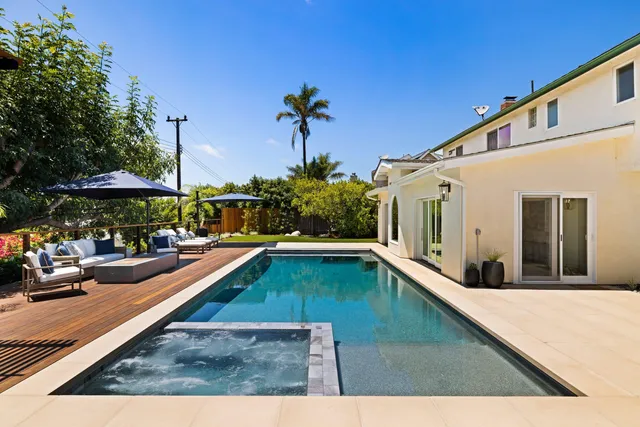 a view of a patio with a table and chairs