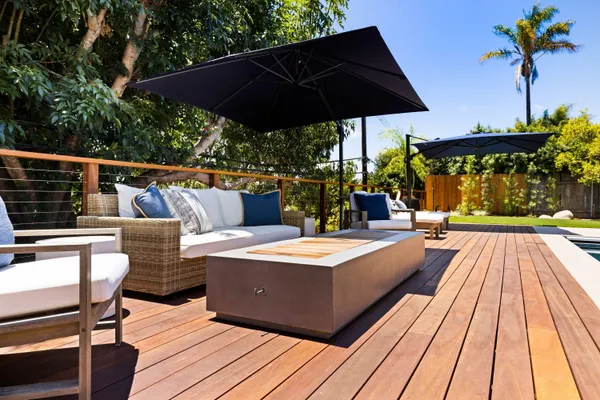 a view of an house with backyard space and balcony