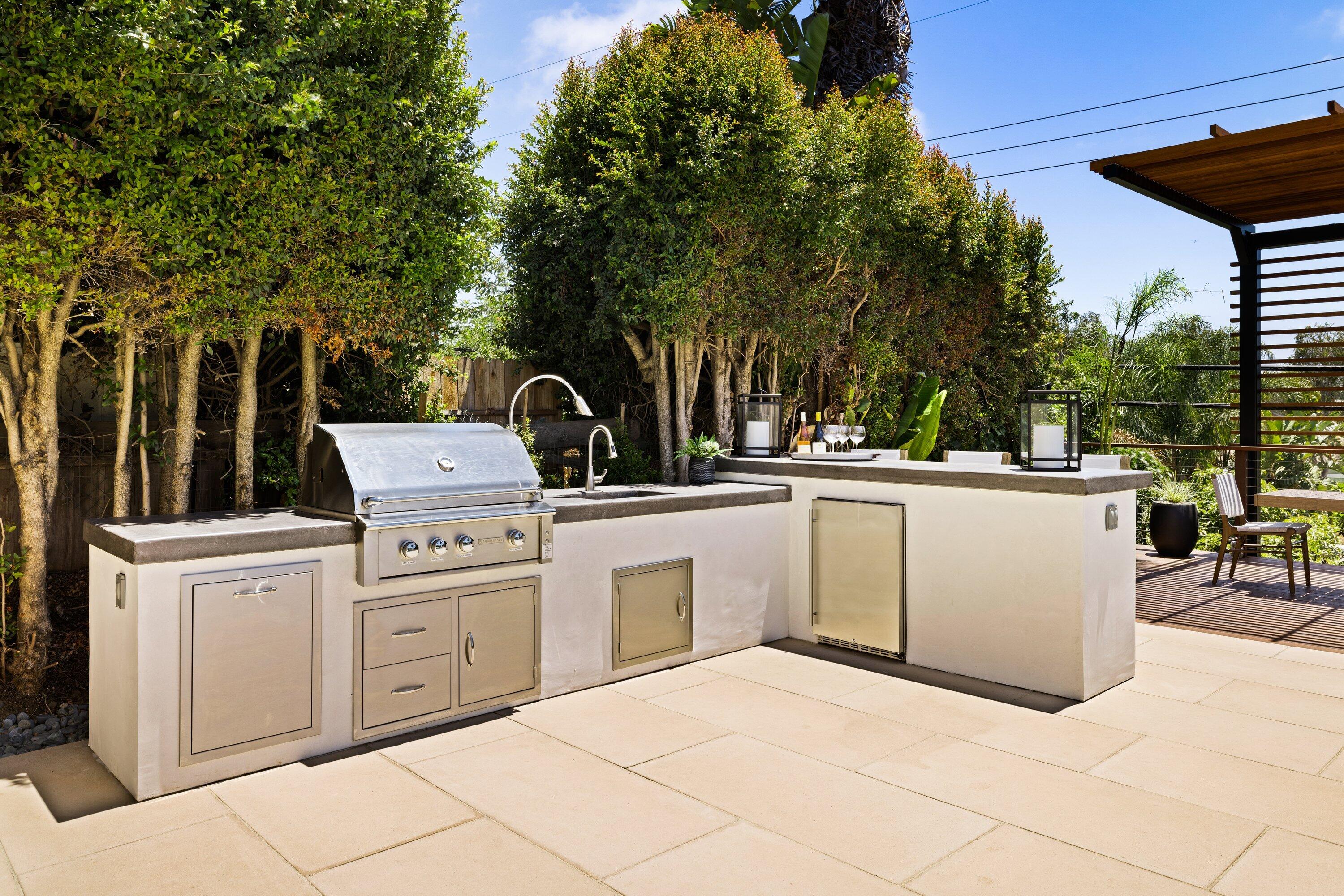 5329 University Drive Santa Barbara, CA 93111 - Photo 45 of 51 a kitchen with a sink and white cabinets