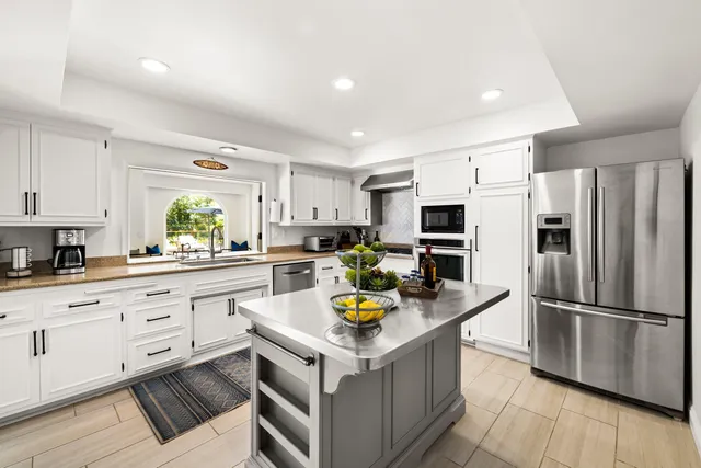 a kitchen with a sink and a window