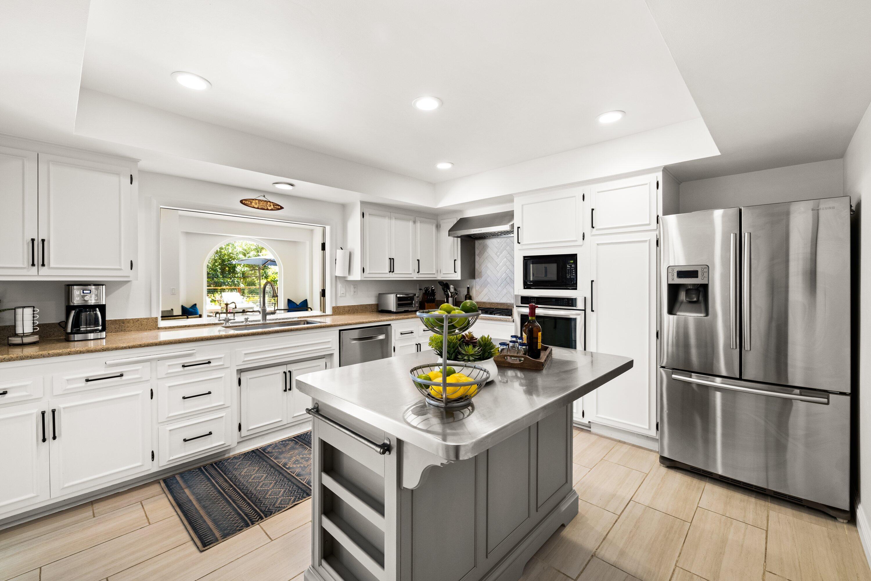 5329 University Drive Santa Barbara, CA 93111 - Photo 5 of 51 a kitchen with stainless steel appliances granite countertop a stove refrigerator and a sink