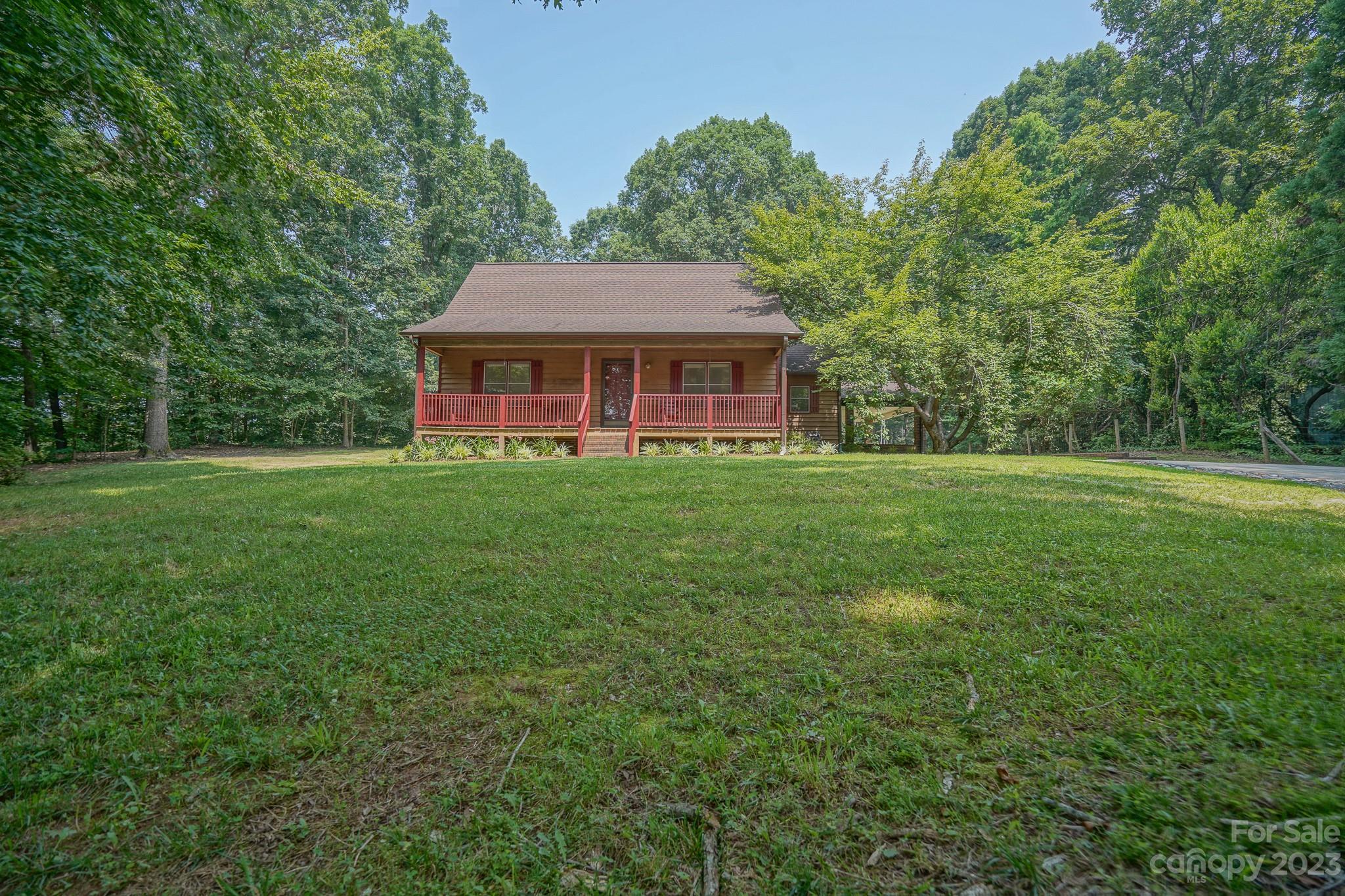 2743 Harmony Highway Harmony, NC 28634 - Photo 1 of 47 a front view of a house with a garden