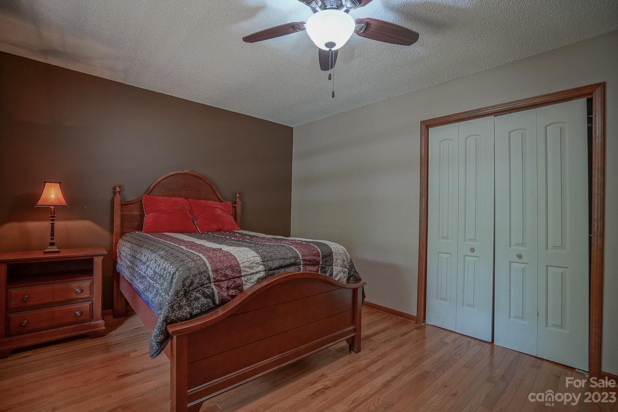 2743 Harmony Highway Harmony, NC 28634 - Photo 16 of 47 a bedroom with a bed and wooden floor