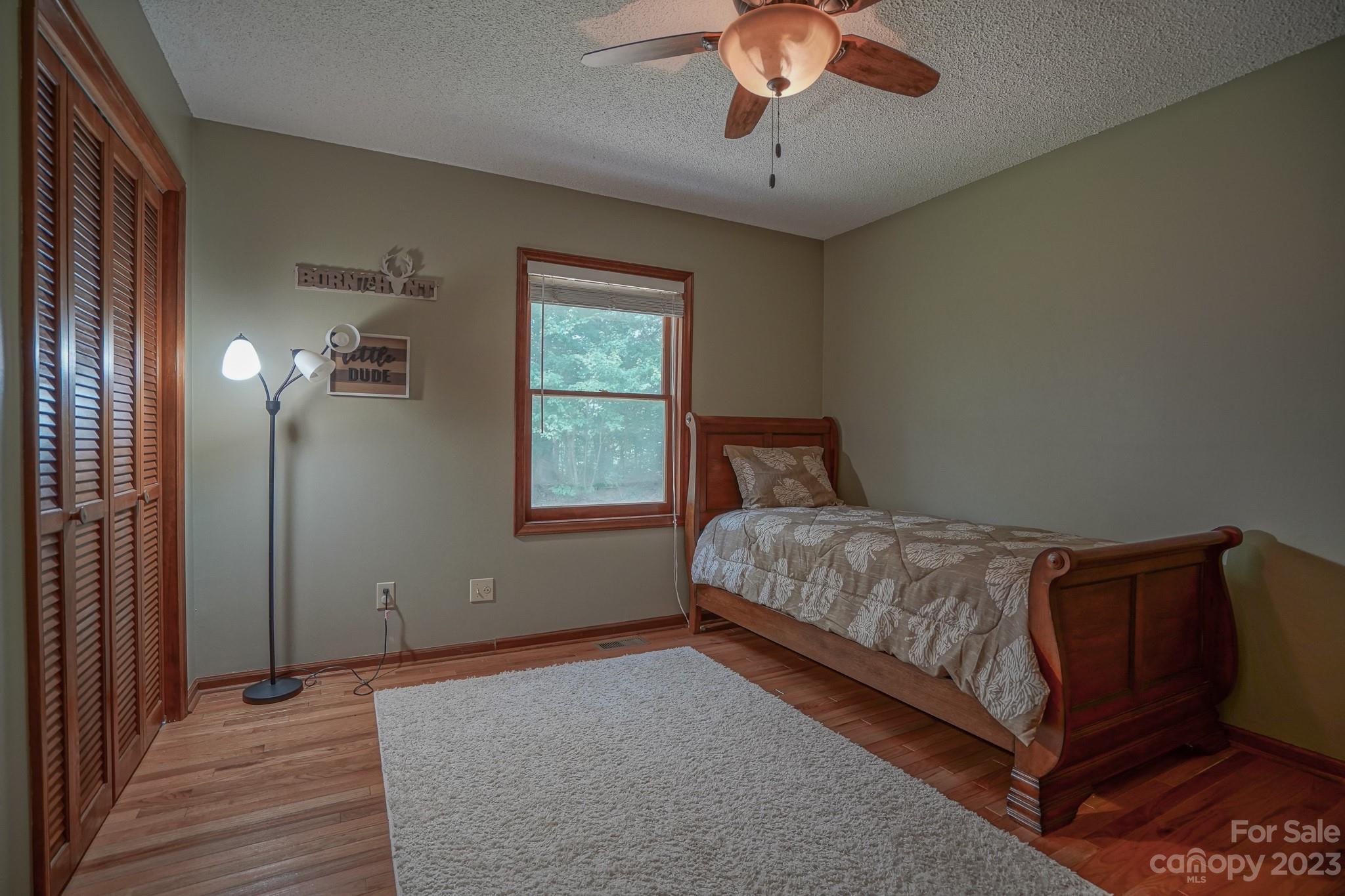 2743 Harmony Highway Harmony, NC 28634 - Photo 18 of 47 a bedroom with a bed and window