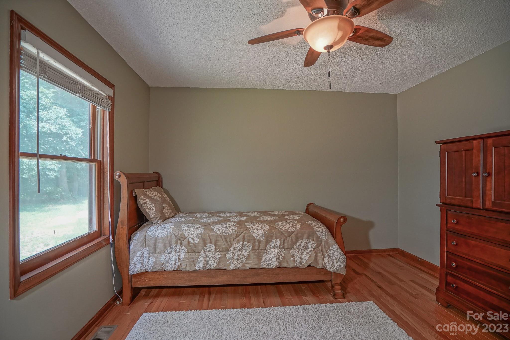 2743 Harmony Highway Harmony, NC 28634 - Photo 20 of 47 a bedroom with a bed and a window