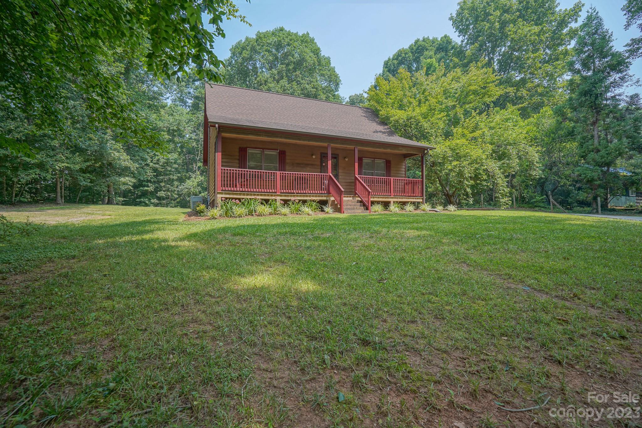 2743 Harmony Highway Harmony, NC 28634 - Photo 2 of 47 a view of a house with a yard