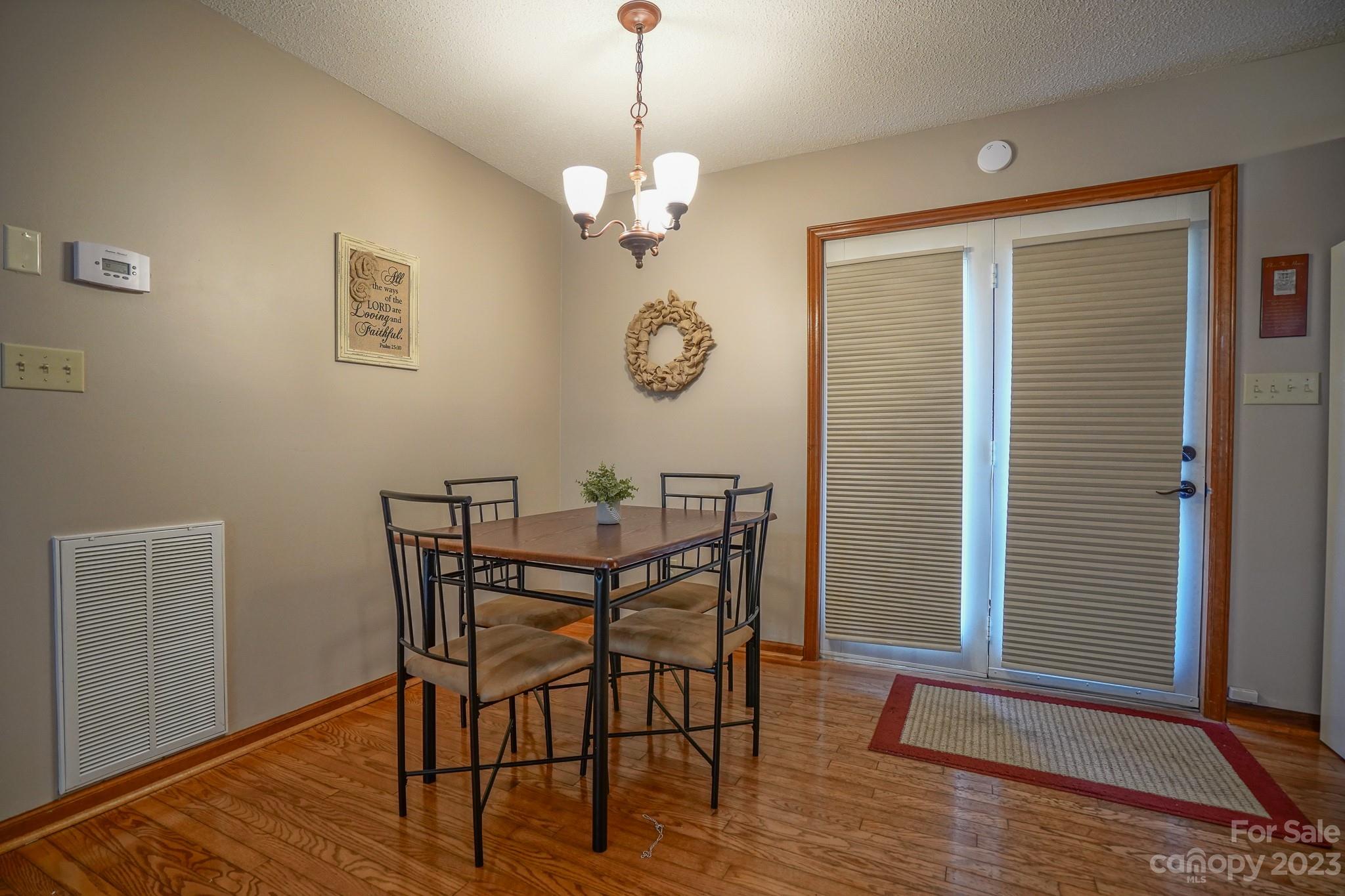 2743 Harmony Highway Harmony, NC 28634 - Photo 27 of 47 a view of a dining room with furniture and wooden floor